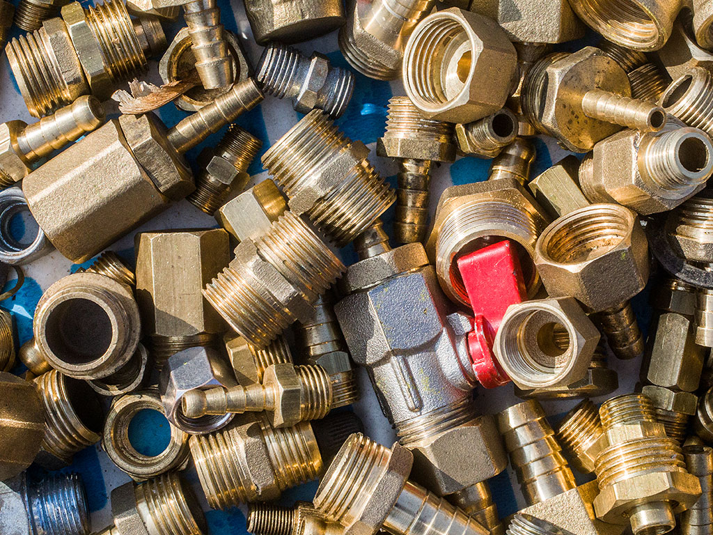 Scrap Brass Nuts and Fittings Ready To Be Recycled Stock Photo